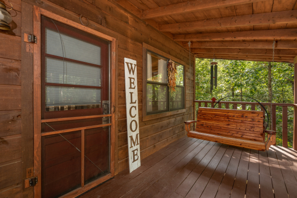 Front Porch with a swing at Misty Mountain Sunrise, a 3 bedroom cabin rental located in Pigeon Forge