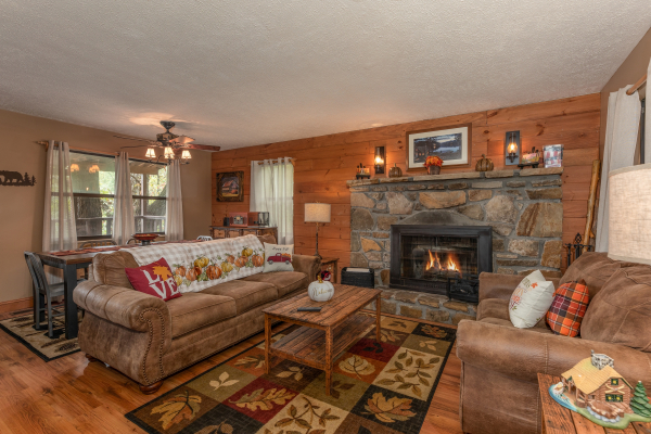 Living room with fireplace at Misty Mountain Sunrise, a 3 bedroom cabin rental located in Pigeon Forge