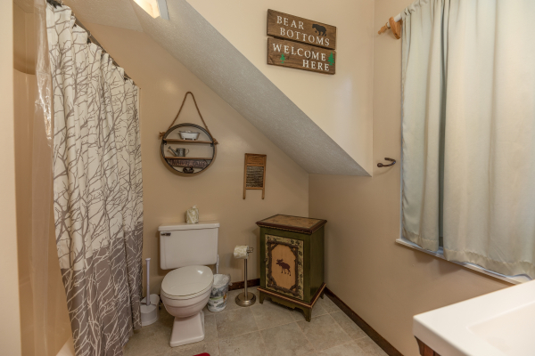Bathroom with a tub and shower at Misty Mountain Sunrise, a 3 bedroom cabin rental located in Pigeon Forge