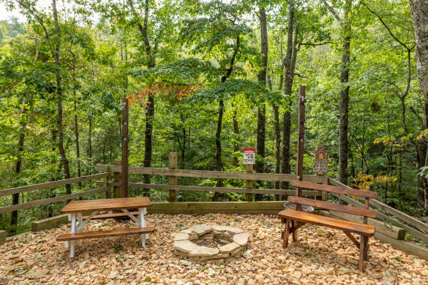 Picnic area with fire pit at Misty Mountain Sunrise, a 3 bedroom cabin rental located in Pigeon Forge