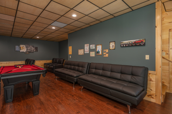 Lots of seating in the game room at Gar Bear's Hideaway, a 3 bedroom cabin rental located in Pigeon Forge
