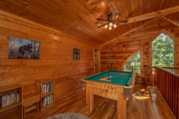 Game loft with a pool table at Majestic Mountain, a 4 bedroom cabin rental located in Pigeon Forge