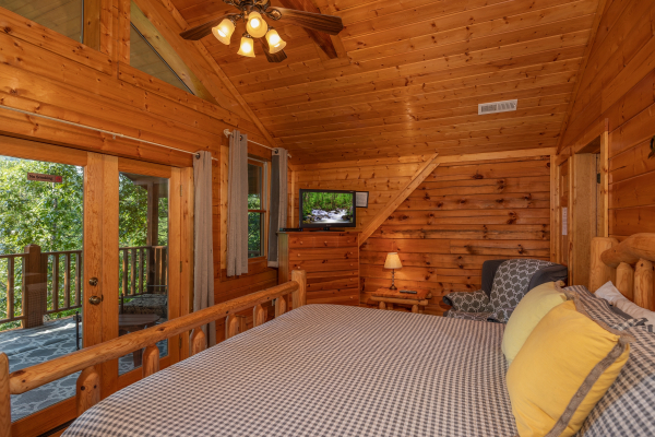 Deck access off the loft bedroom at Majestic Mountain, a 4 bedroom cabin rental located in Pigeon Forge