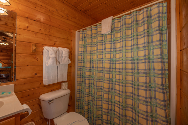 Bathroom with a tub and shower at Majestic Mountain, a 4 bedroom cabin rental located in Pigeon Forge