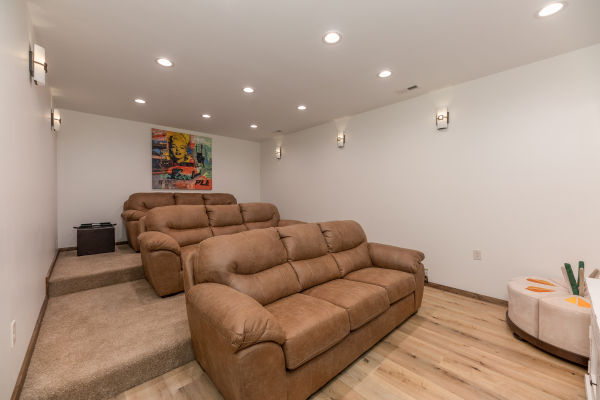 Theater room with sofa seating at Mountain Celebration, a 4 bedroom cabin rental located in Gatlinburg