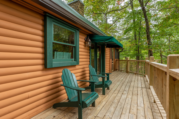Adirondack chairs on a deck at Yes, Deer, a 2 bedroom cabin rental located in Pigeon Forge