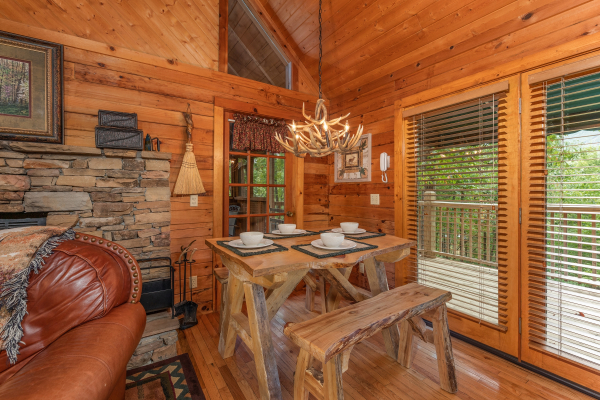 Dining space for four at Yes, Deer, a 2 bedroom cabin rental located in Pigeon Forge