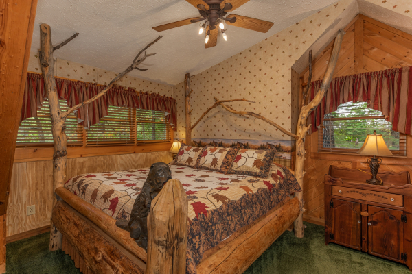Bedroom with unique tree bed at Yes, Deer, a 2 bedroom cabin rental located in Pigeon Forge