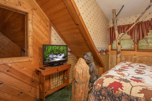 TV in a bedroom at Yes, Deer, a 2 bedroom cabin rental located in Pigeon Forge