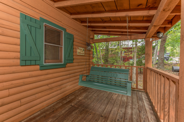 Porch swing at Yes, Deer, a 2 bedroom cabin rental located in Pigeon Forge