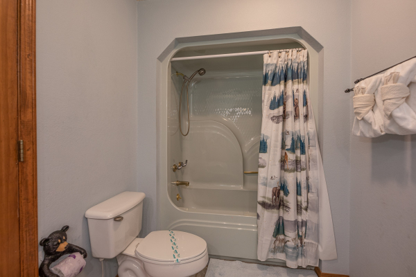 Bathroom with a tub and shower at Lazy Bear Retreat, a 4 bedroom cabin rental located in Pigeon Forge