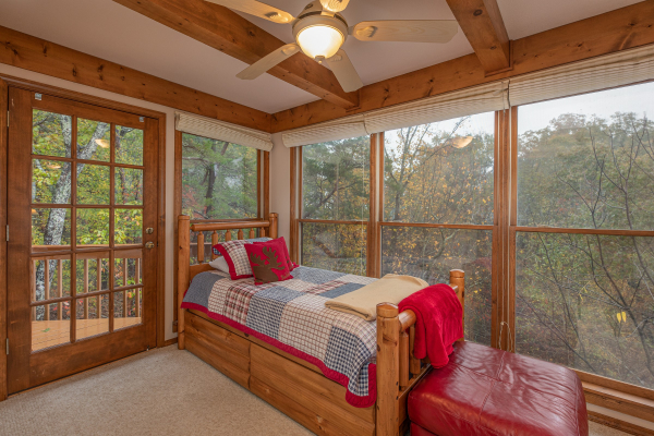 Twin bed upstairs in the futon room at Lazy Bear Retreat, a 4 bedroom cabin rental located in Pigeon Forge