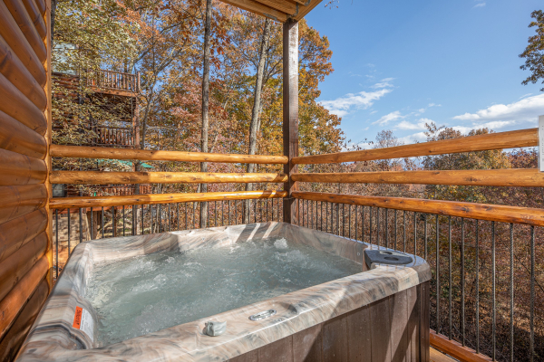 Hot tub on a deck at Pinot Splash, a 4 bedroom cabin rental located in Gatlinburg
