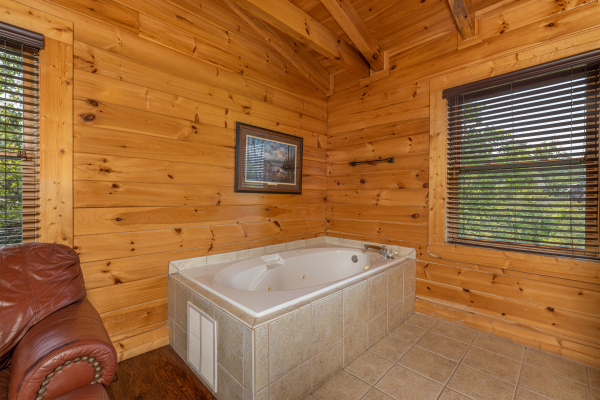 Jacuzzi in master bedroom at Loving Every Minute, a 5 bedroom cabin rental located in Pigeon Forge 