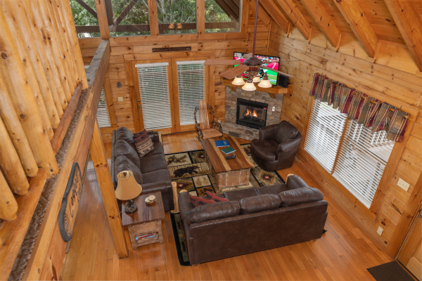 Looking down at the living room at Logged Inn, a 3 bedroom cabin rental located in Pigeon Forge