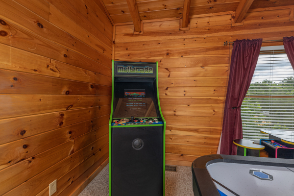 Arcade game at Logged Inn, a 3 bedroom cabin rental located in Pigeon Forge