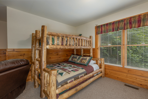 Bunk beds at Logged Inn, a 3 bedroom cabin rental located in Pigeon Forge