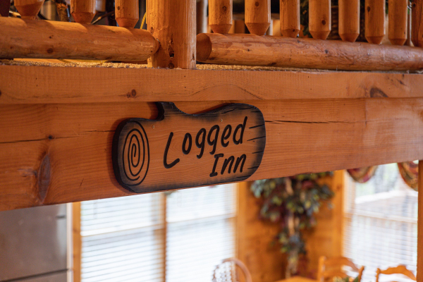 Log art at Logged Inn, a 3 bedroom cabin rental located in Pigeon Forge