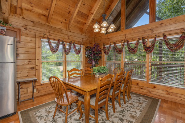 Dining table for 8 at Logged Inn, a 3 bedroom cabin rental located in Pigeon Forge