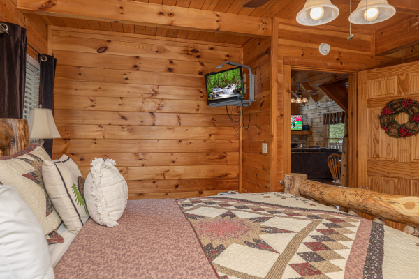 TV in a bedroom at Logged Inn, a 3 bedroom cabin rental located in Pigeon Forge