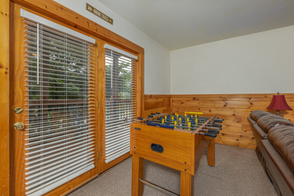 Foosball table at Logged Inn, a 3 bedroom cabin rental located in Pigeon Forge