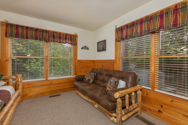 Futon at Logged Inn, a 3 bedroom cabin rental located in Pigeon Forge