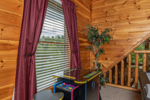Multi game arcade at Logged Inn, a 3 bedroom cabin rental located in Pigeon Forge