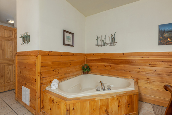 Corner jacuzzi tub at Logged Inn, a 3 bedroom cabin rental located in Pigeon Forge