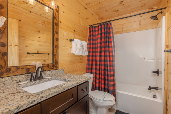 Bathroom with a tub and shower at Bessy Bears Cabin, a 2 bedroom cabin rental located inGatlinburg