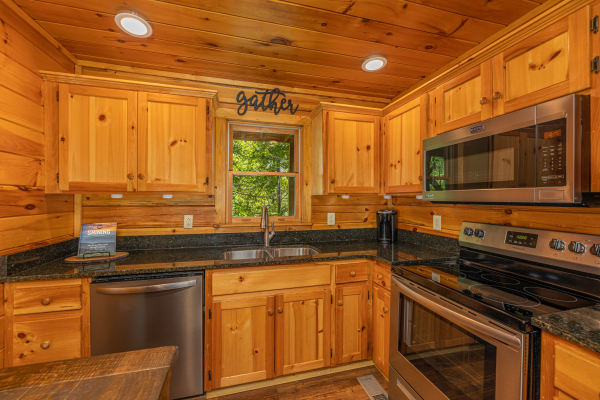 Kitchen with stainless appliances at Moonlit Pines, a 2 bedroom cabin rental located in Pigeon Forge