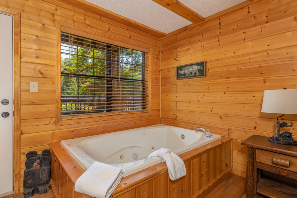 In room jacuzzi at Pool Side Lodge, a 6 bedroom cabin rental located in Pigeon Forge