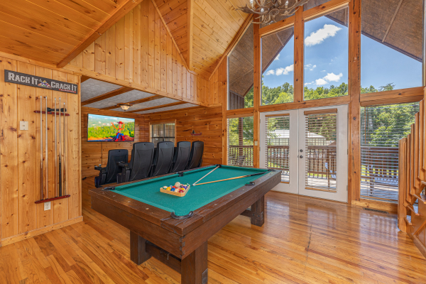 Pool table in a lofted space at Pool Side Lodge, a 6 bedroom cabin rental located in Pigeon Forge