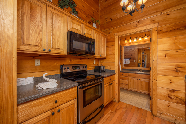 Kitchen stove at Mountain Laurel Lodge, a 4 bedroom cabin rental located in Pigeon Forge