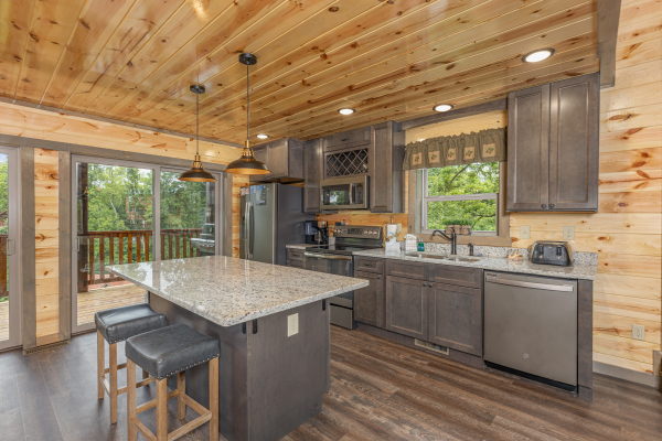 Breakfast bar with seating for two at Alpine Adventure, a 4 bedroom cabin rental located in Pigeon Forge