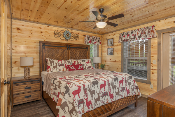 Bedroom with two night stands and two lamps at Alpine Adventure, a 4 bedroom cabin rental located in Pigeon Forge