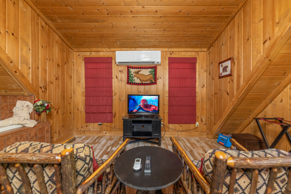 Seating area with TV at A Beary Nice Cabin, a 2 bedroom cabin rental located in Pigeon Forge