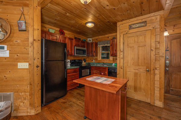 Kitchen with black appliances at A Beary Nice Cabin, a 2 bedroom cabin rental located in Pigeon Forge