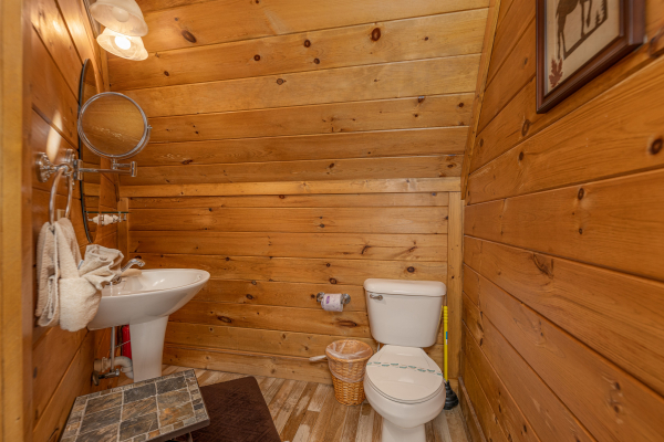 Half bath at A Beary Nice Cabin, a 2 bedroom cabin rental located in Pigeon Forge