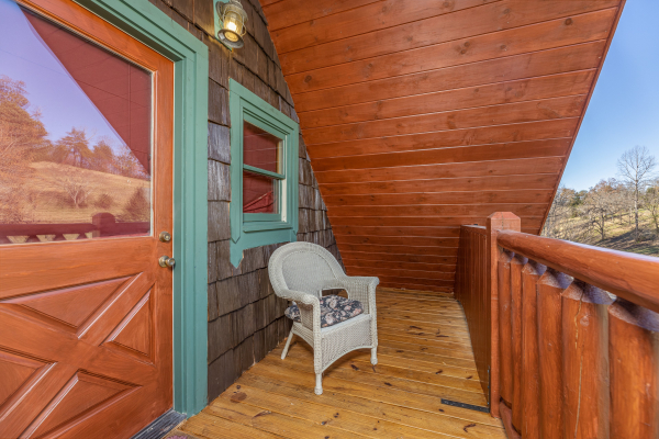 Wicker chair on a deck at A Beary Nice Cabin, a 2 bedroom cabin rental located in Pigeon Forge