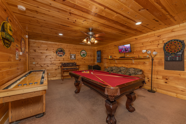 Pool table and shuffleboard at King Wolf Lodge, a 3 bedroom cabin rental located in Pigeon Forge