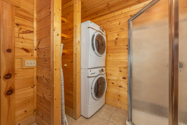 Stacked washer and dryer at King Wolf Lodge, a 3 bedroom cabin rental located in Pigeon Forge