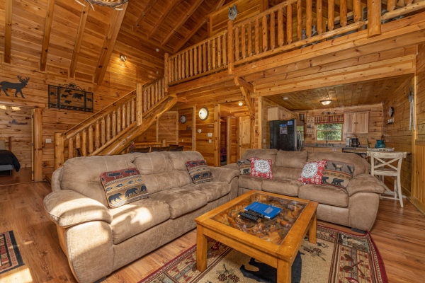 Two sofas in a living room at King Wolf Lodge, a 3 bedroom cabin rental located in Pigeon Forge