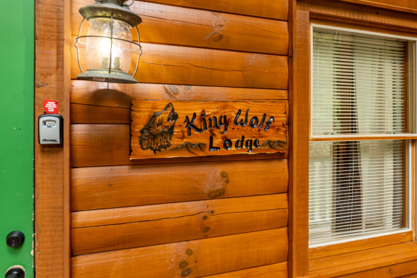 Sign at King Wolf Lodge, a 3 bedroom cabin rental located in Pigeon Forge