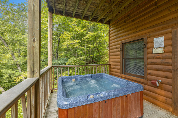 Hot tub at Honeysuckle Hideaway, a 1 bedroom cabin rental located in Pigeon Forge