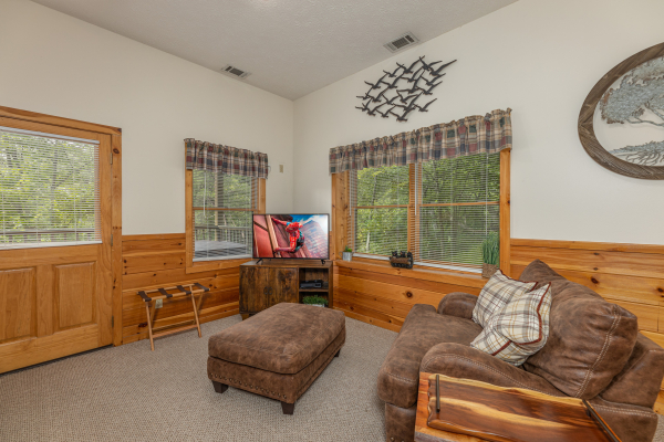 Sitting area in the bedroom at Honeysuckle Hideaway, a 1 bedroom cabin rental located in Pigeon Forge