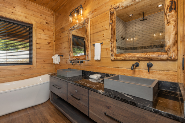 Double vanity and soaker tub in a bathroom at Black Bears & Biscuits Lodge, a 6 bedroom cabin rental located in Pigeon Forge