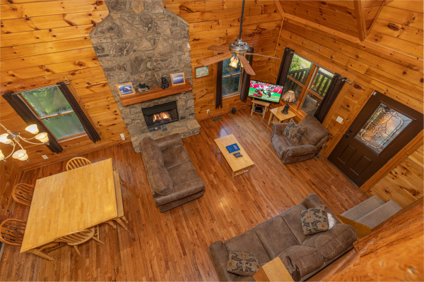 Looking down at the living room at Family Getaway, a 4 bedroom cabin rental located in Pigeon Forge