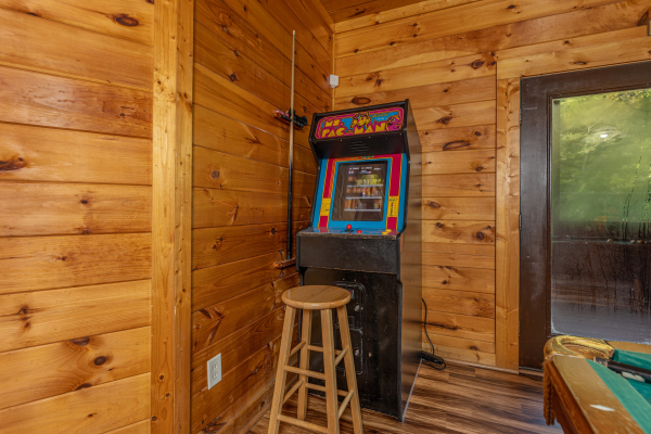 Arcade game at Family Getaway, a 4 bedroom cabin rental located in Pigeon Forge