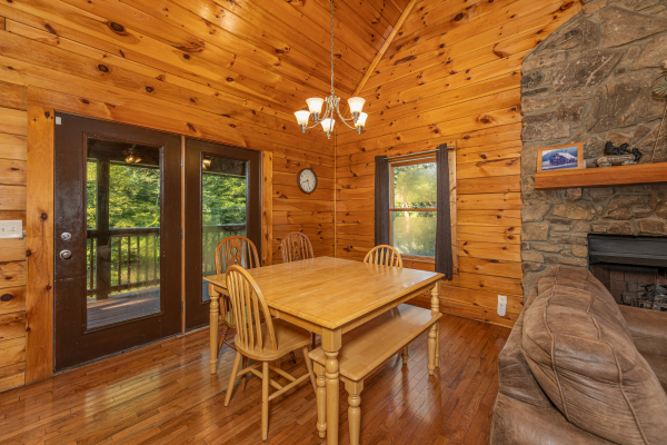 Dining room with seating for 6 at Family Getaway, a 4 bedroom cabin rental located in Pigeon Forge