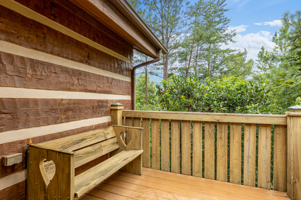 Bench on a deck at Cubs' Crib, a 3 bedroom cabin rental located in Gatlinburg